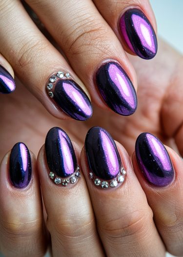 Elegant dark purple holographic nails with gemstones showcasing modern nail art design.