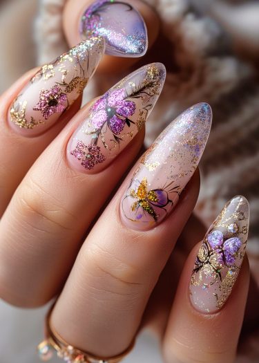 Exquisite almond-shaped nails featuring elegant floral designs in lavender and gold accents.