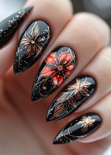 Elegant black nail art with floral designs in red and copper for a sophisticated look.