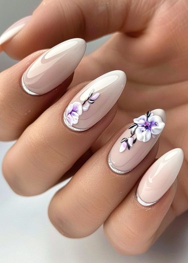 Elegant floral nail art design with nude pink base and intricate flowers, perfect for any occasion.