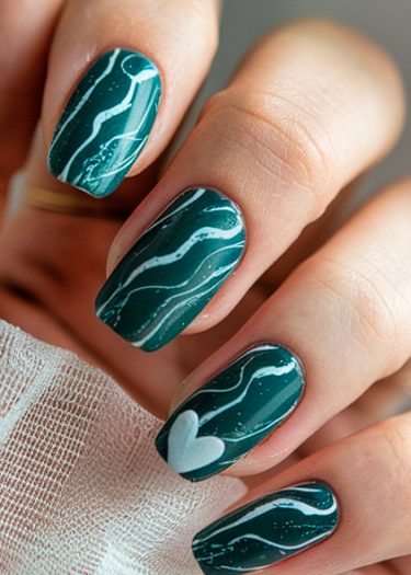 Elegant forest green nails with white wave art and a heart design on the ring finger.