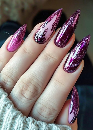 Glamorous stiletto nail art in deep magenta and pink with sparkling glitter details.