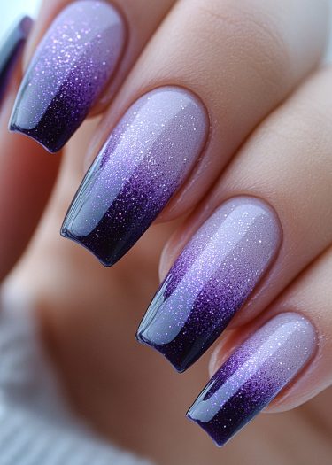 Sophisticated purple ombre nail art with glitter on elegant medium-long square nails.