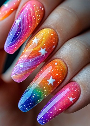 Cosmic gradient nails with vibrant colors and whimsical star designs for a stunning look.