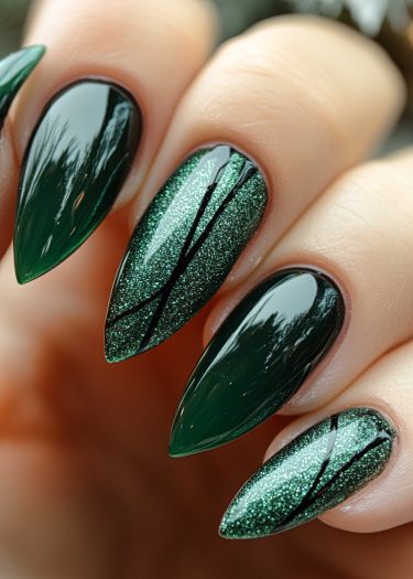 Elegant dark green almond nails with glitter and artistic black designs for stunning nail art.