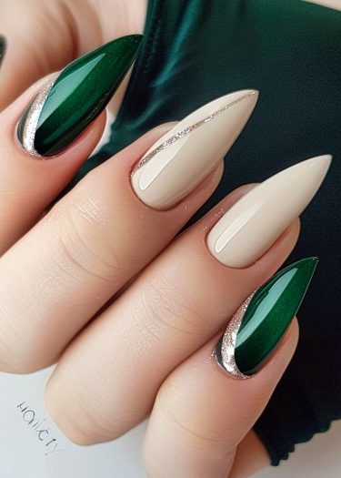 Elegant green and beige nail art with silver accents against a textured dark green background.