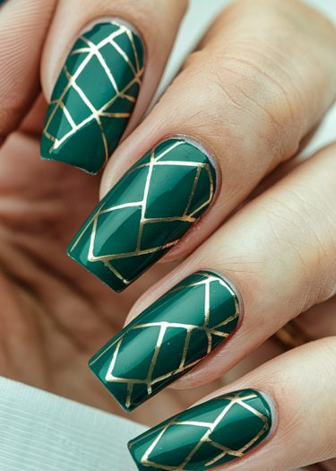 Elegant green coffin nails with gold geometric design for trendy nail art inspiration.