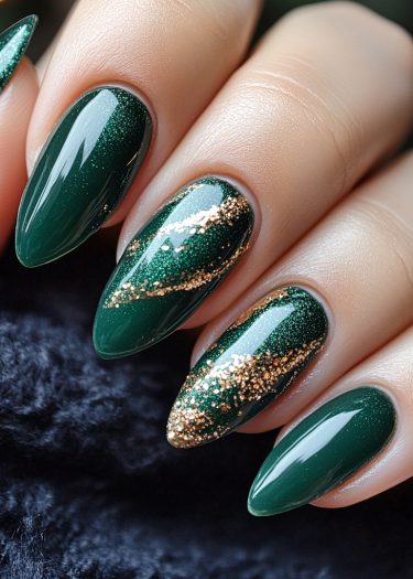 Elegant green almond nails with gold glitter design, perfect for festive occasions and luxury.