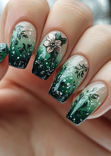 Elegant green gradient nail art with intricate vines and a 3D flower embellishment.