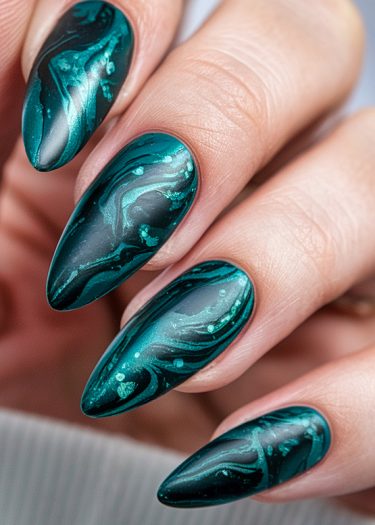 Elegant green marble nails with intricate designs and a glossy finish create a sophisticated look.