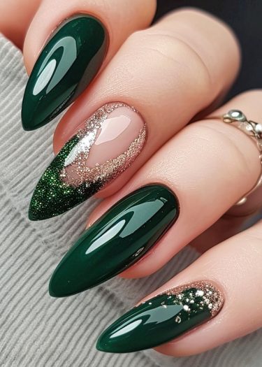 Elegant green nail design featuring glossy almond-shaped nails with artistic gold accents and glitter.