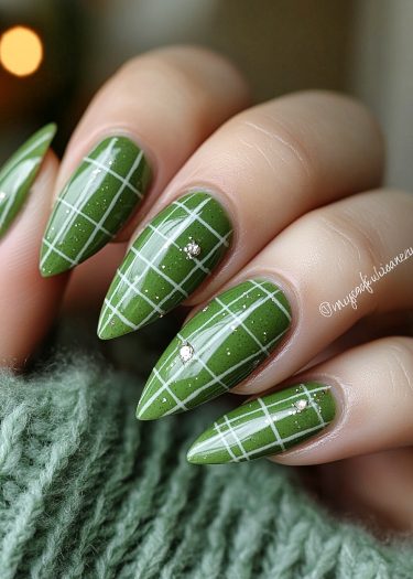 Elegant green plaid nails with rhinestones and a textured green sweater for a chic autumn look.