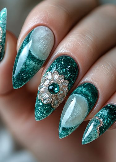 Elegant green stiletto nails with intricate floral designs and shimmering accents for luxurious nail art.