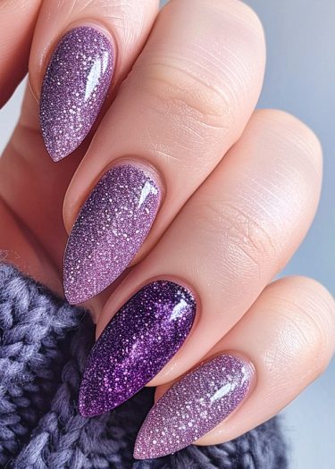 Elegant lavender gradient nails with glitter, showcasing a stylish and luxurious manicure.