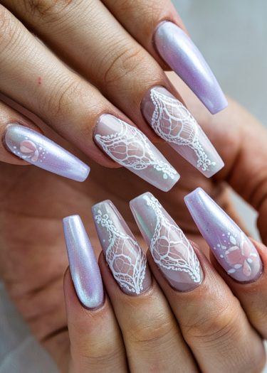 Elegant lavender nail art with intricate lace designs, perfect for sophisticated styles and occasions.