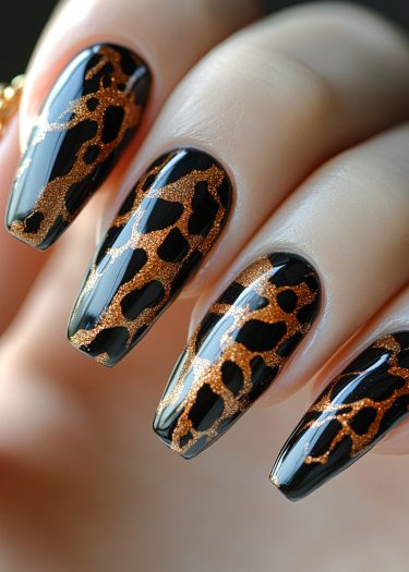 Elegant leopard print nail art on long almond-shaped nails with glossy black and shimmering gold accents.