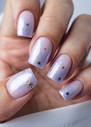 Elegant lilac nail art featuring metallic star decals for a whimsical, sophisticated look.