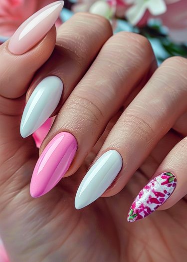 Elegant stiletto nails featuring vibrant colors and floral designs for a sophisticated manicure.