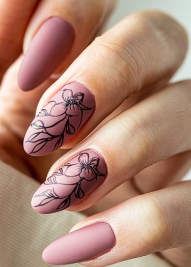 Elegant mauve almond nails with floral designs, showcasing sophisticated matte finish and artistry.