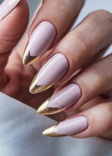 Elegant mauve nail art with gold tips, perfect for chic and modern styles.