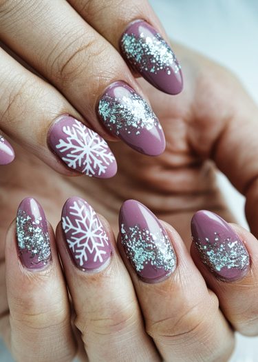 Elegant mauve nail art with intricate snowflakes and sparkling silver glitter accents for winter.