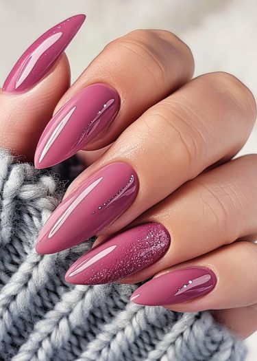 Elegant mauve stiletto nails with chic silver accents and glitter, perfect for sophisticated style.