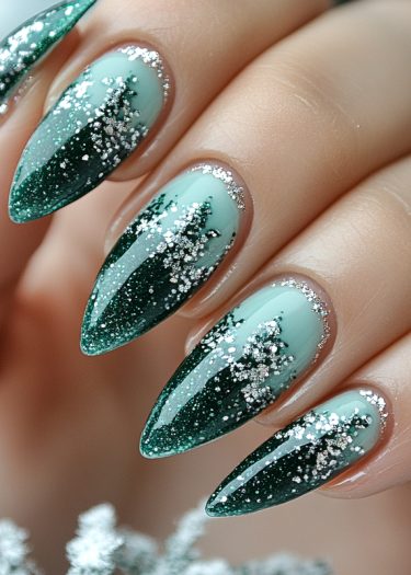 Elegant mint green nail art with silver glitter, showcasing a refined almond shape and glossy finish.