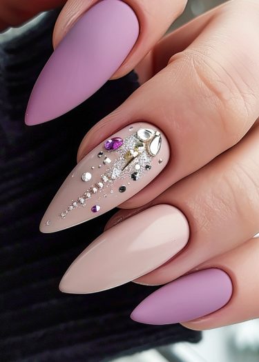 Elegant almond-shaped nails with matte finishes and stunning jeweled designs for a chic look.