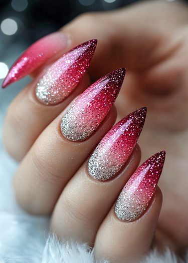 Elegant almond-shaped ombre nails in pink with glitter, showcasing sophisticated nail art design.