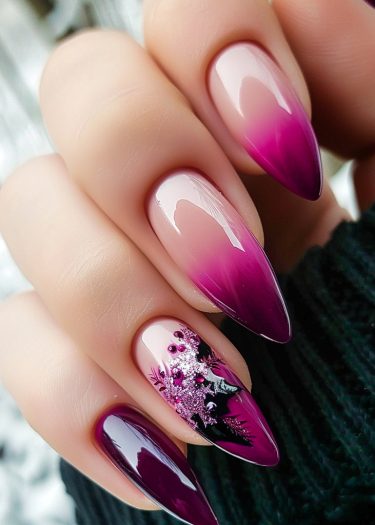 Stylish ombre manicure with elegant stiletto nails and intricate floral designs.