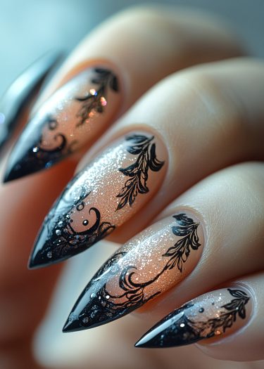 Elegant peach gradient nail art with shimmering glitter and intricate black designs.