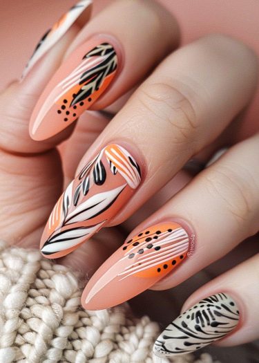 Elegant peach nail art featuring intricate designs and almond-shaped nails for a stylish look.