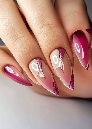 Stunning stiletto nails with magenta and pink hues, featuring elegant artistic designs.