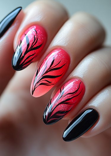 Elegant red and black nail art featuring intricate designs and a glossy finish.