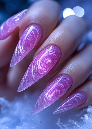 Elegant stiletto nails with pink and white glittery marble design, showcasing beautiful nail art.