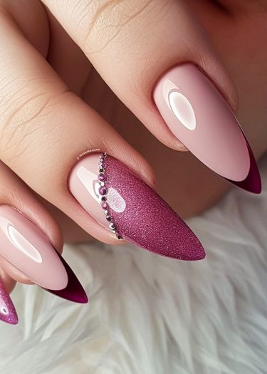 Elegant pink and plum nail art with rhinestones on glossy almond-shaped nails.