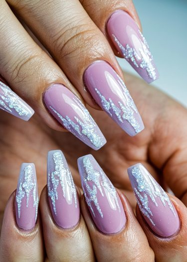 Elegant pink coffin nails with sparkling silver glitter icicle designs for a luxurious manicure.