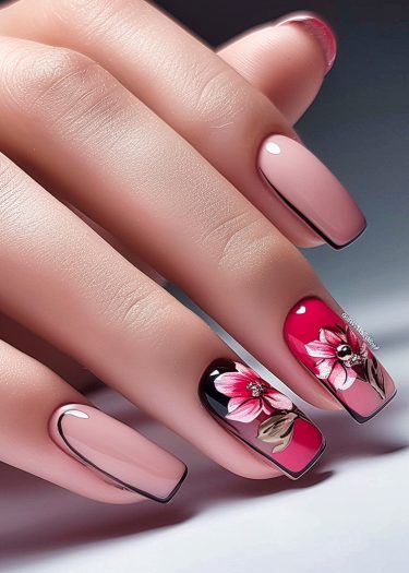 Elegant pink nail art featuring intricate floral designs and modern accents for a chic look.