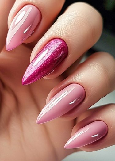 Elegant pink stiletto nails with a shiny gradient and a striking magenta accent nail.