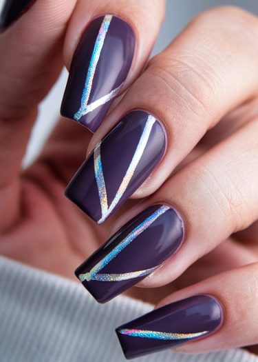 Elegant purple coffin nails with holographic designs, perfect for stylish nail art enthusiasts.