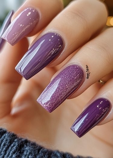 Elegant purple coffin nails with glossy finishes and glittering designs, showcasing stylish nail art.