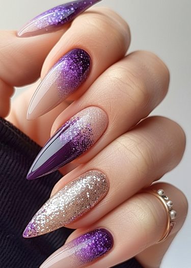 Elegant purple glitter nails with intricate designs and a stunning gradient effect.