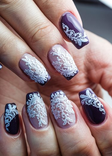 Elegant purple lace nails with intricate designs for a chic, modern manicure.