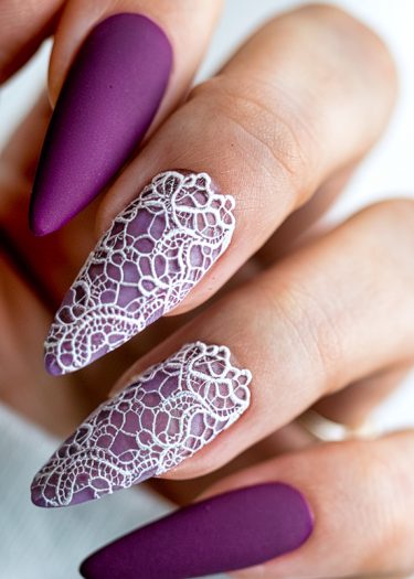 Elegant purple lace nails featuring matte finish and intricate designs for a sophisticated look.