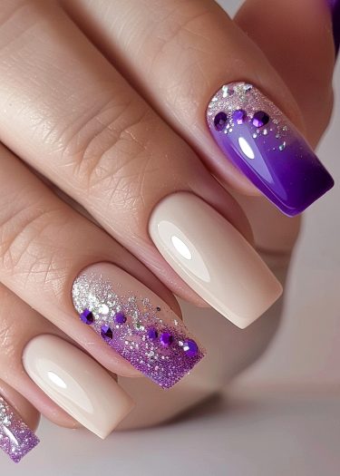 Elegant purple nail art featuring creative designs and glitter accents for a stunning manicure.