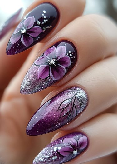 Elegant purple nail art with floral designs and glittery accents for sophisticated manicures.