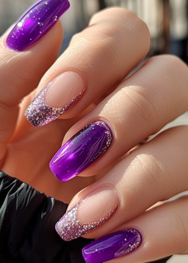 Elegant purple nail design featuring marbling and glitter for a luxurious manicure look.