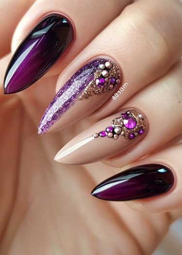 Stunning almond-shaped purple and nude nail art with intricate designs and embellishments.