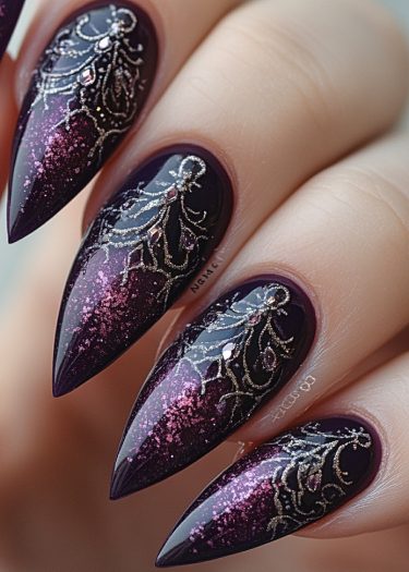 Elegant stiletto nails featuring purple ombre, pink glitter, and intricate silver designs.