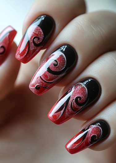 Elegant red and black nail art with intricate swirls and glitter for a striking look.